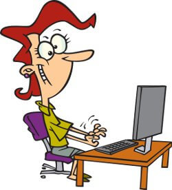 a woman typing on a computer